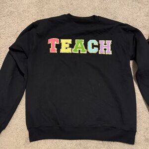 NWOT: Black Sweatshirt with Colorful 'TEACH' Design size medium free shipping